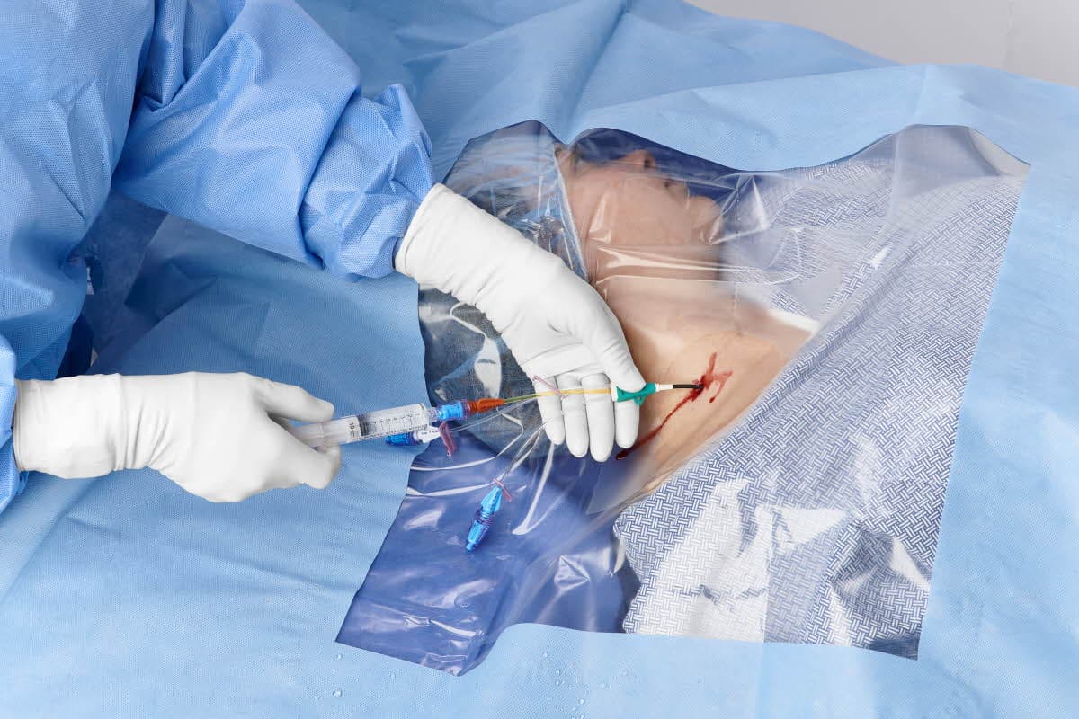 Clinician performing central venous catheter insertion